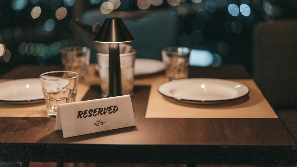 White ceramic plate on brown wooden table