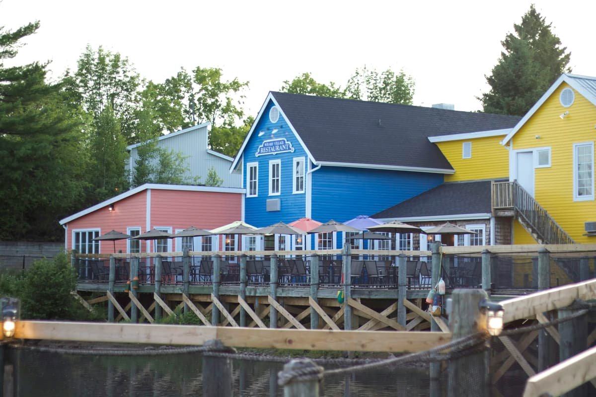 Blue and white wooden house near body of water during daytime in Moncton, New Brunswick